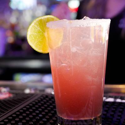 Double Strawberry Margarita placed on a bar counter.