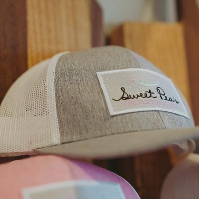 Hats with the restaurant's name.
