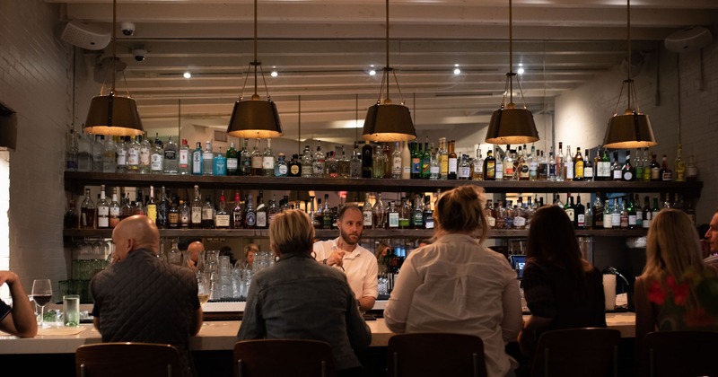 Customers sitting at the bar