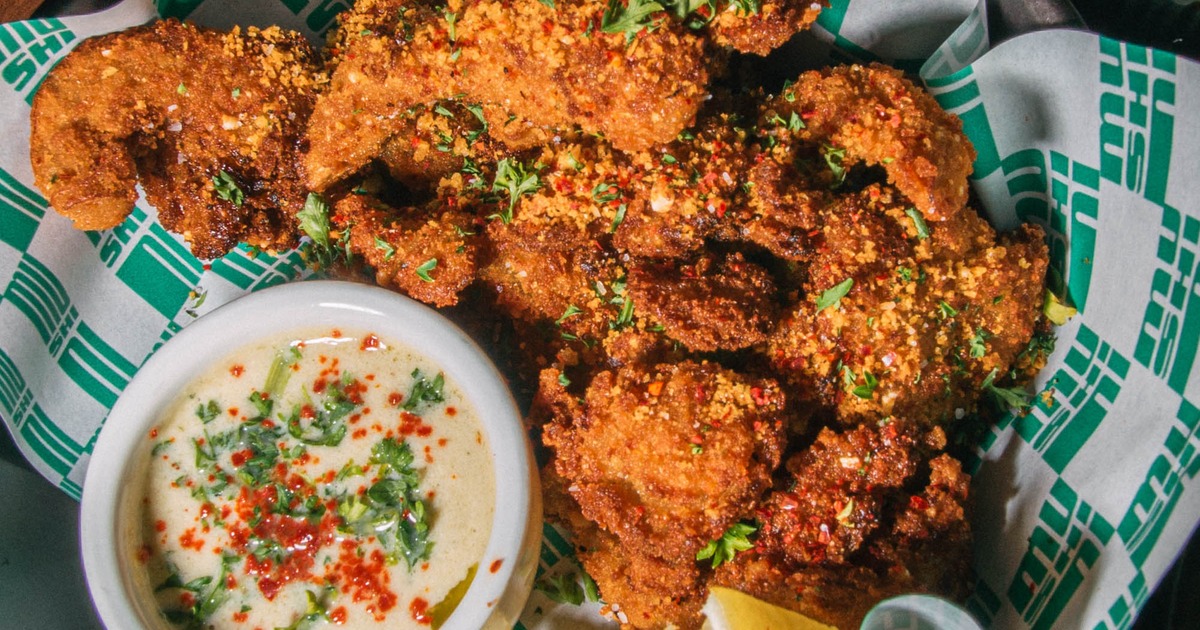 Crispy fried chicken pieces served with a creamy dipping sauce