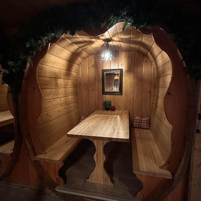 Enclosed wooden dining booth.