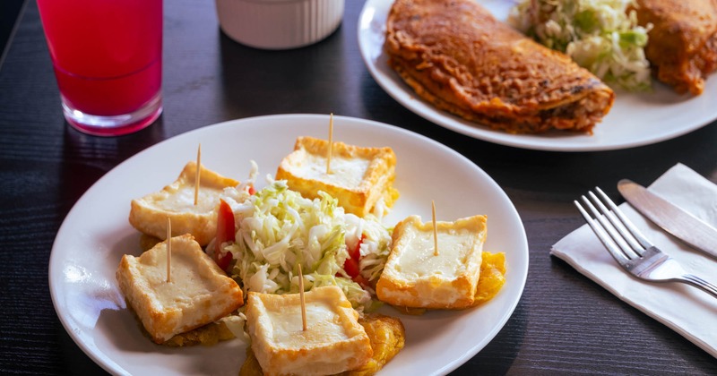 Fried cheese and plantain bites with cabbage slaw
