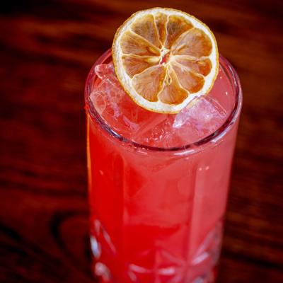 Save Kings Beach cocktail with lime garnish.