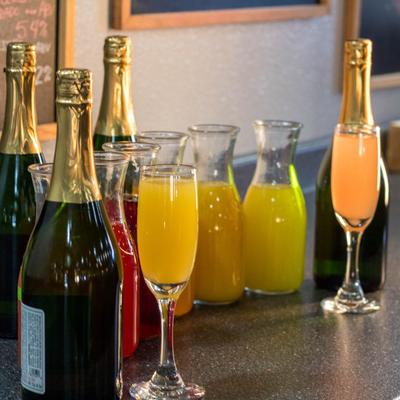 Various beverages in bottles and glasses.