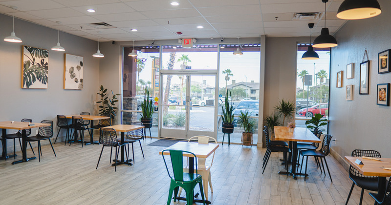 Well -lit, spacious interior - tables, chairs