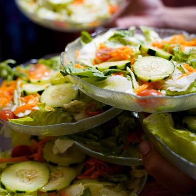 Various salads stacked on top of each other