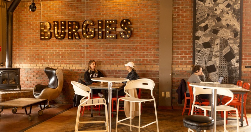 Interior, people sitting at tables