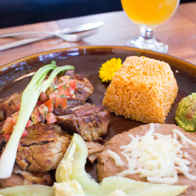 A short rib enchilada plate, closeup.
