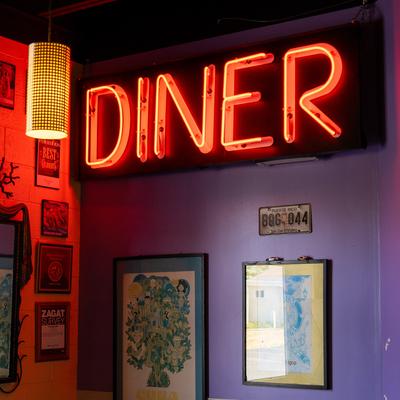 Diner light sign on the interior wall.
