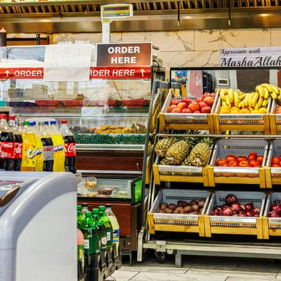 Produce stand showcasing fresh fruits and vegetables.