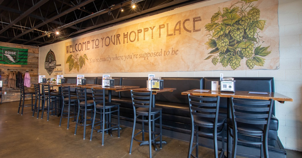 Bench seating along wall with barstool seating on opposite side.