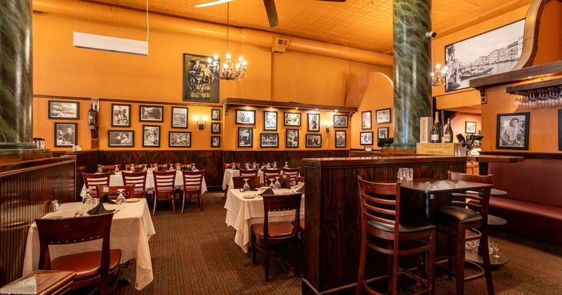 Interior, dining area, tables and seats, pictures on the walls