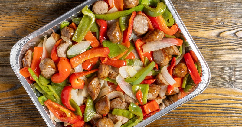 Roasted sausage slices with bell peppers and onions