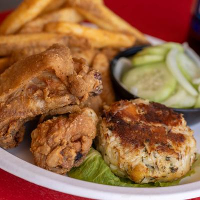 Freid chicken and a crab cake.