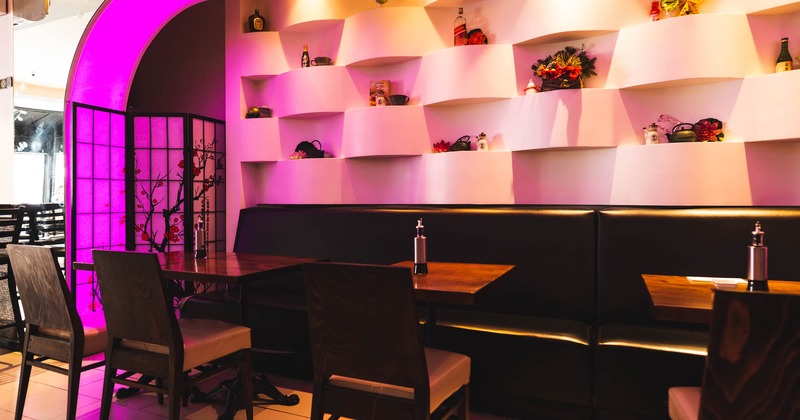 Interior, banquette seating by a decorated wall