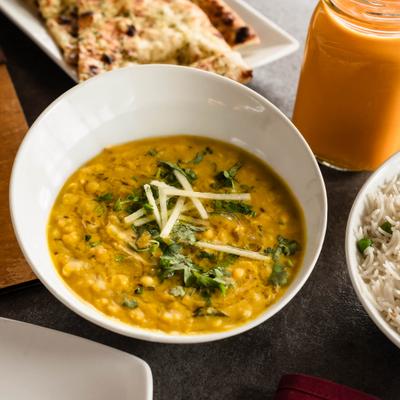 Black lentils simmered with red kidney beans, butter, and cream.
