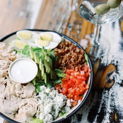 Cobb salad served with a martini.