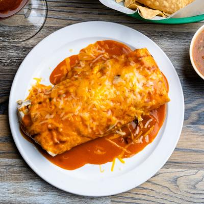 Burrito Especial covered in enchilada sauce and melted cheese.