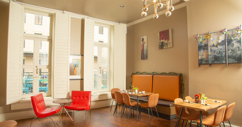 Interior, tables and chairs by the window