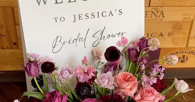 Bridal Shower welcome board with colorful flowers