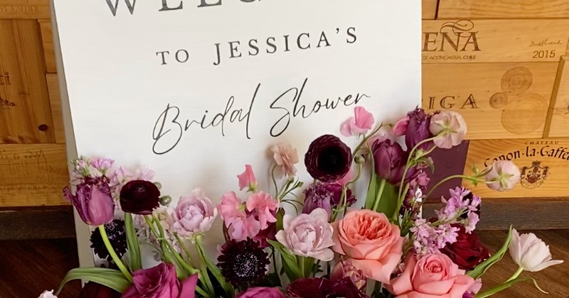 Bridal Shower welcome board with colorful flowers