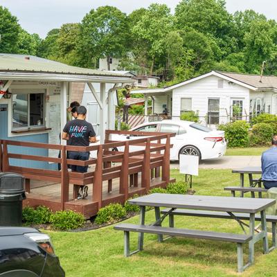 Outdoor seating area, picnic tables.