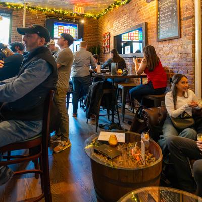 Interior, people enjoying themselves over drinks.