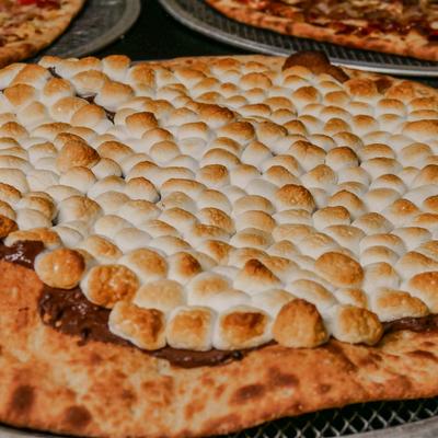 S'mores Pizza featuring a chocolate base and toasted marshmallows.