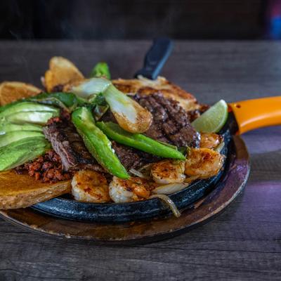 Steak, shrimp, and chicken fajitas.