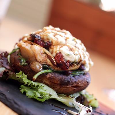 Roasted stuffed mushroom cap.