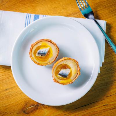 Eggs served on plate, top view