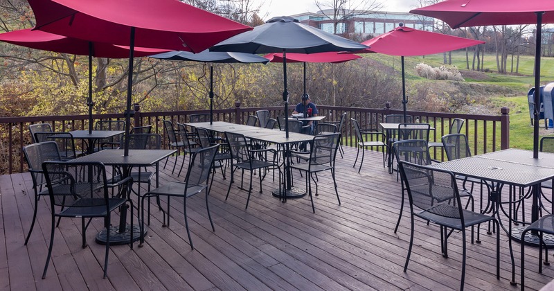 Exterior, patio with tables, chairs and parasols