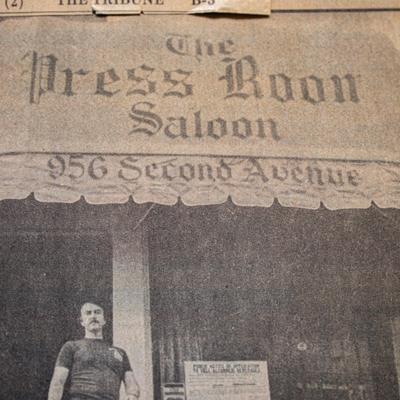 A vintage photo of a person in front of The Press Room Saloon