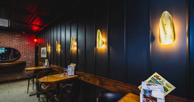 Interior, tables and chairs near wall