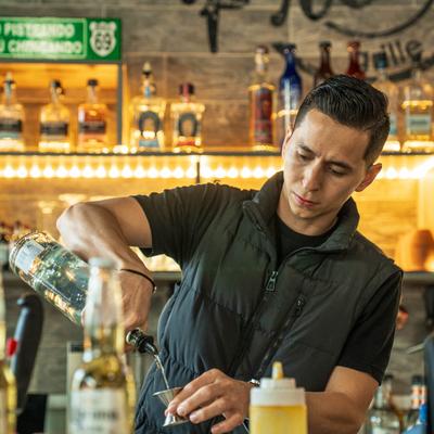 A person preparing a drink.