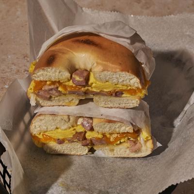 Bagel with ham, cheese, and egg.