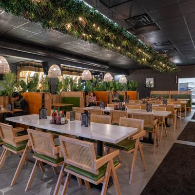 Interior with both table and booth seating and various decorations.