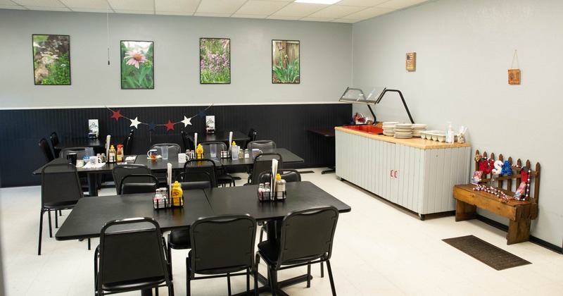 Interior, tables and chairs in dining area