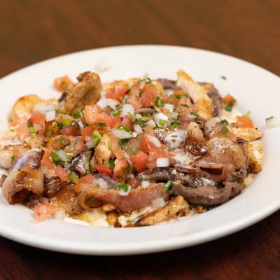 Grilled shrimp, sauteed with tomato, onion, and mushrooms.