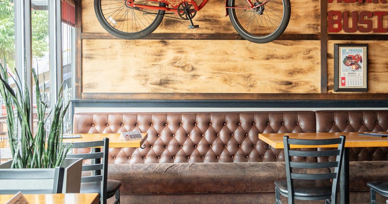 Interior, booths, bicycle on the wall for decoration