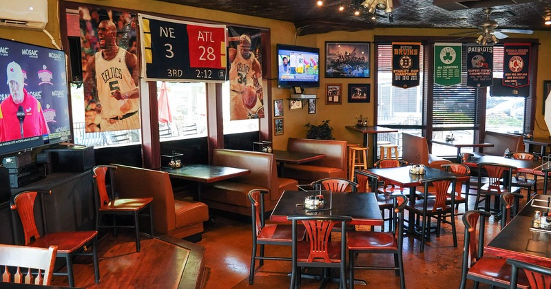 Interior, dining area, booths and tables, decorations on windows, TV screens