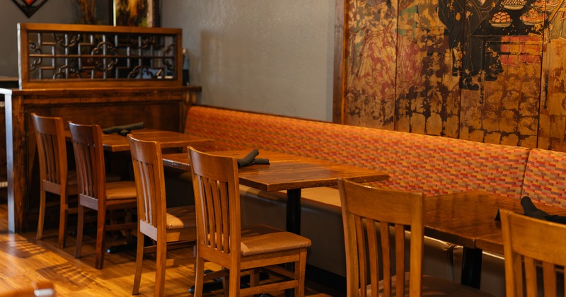 Lined up wooden tables and chairs