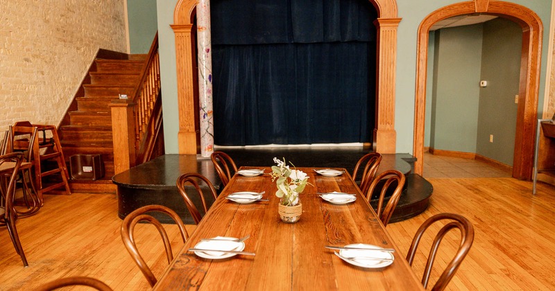 Interior, long table ready for guests