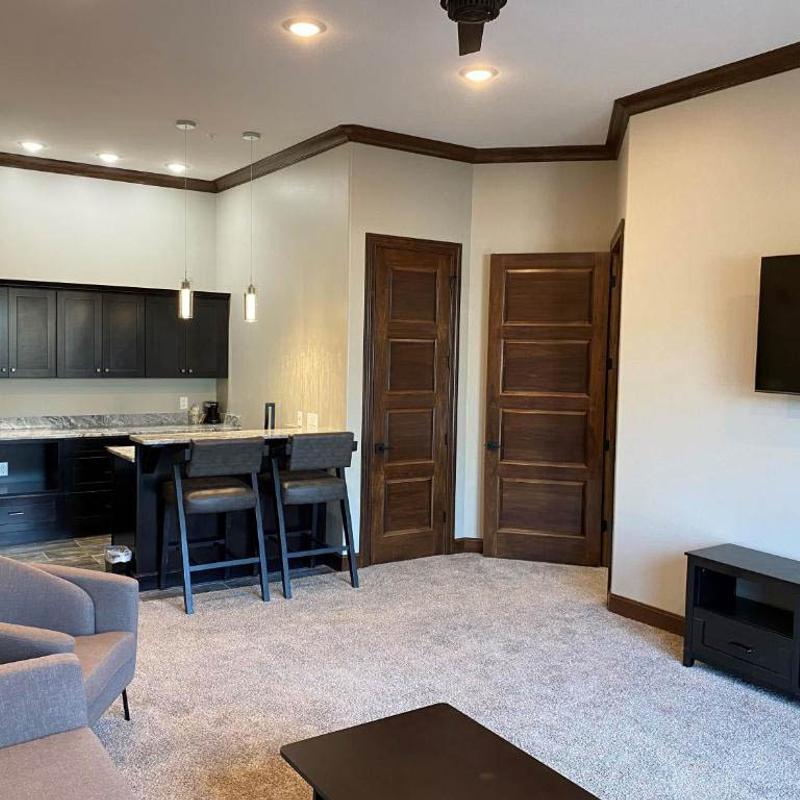 An apartment interior, tables, chairs, other furniture.