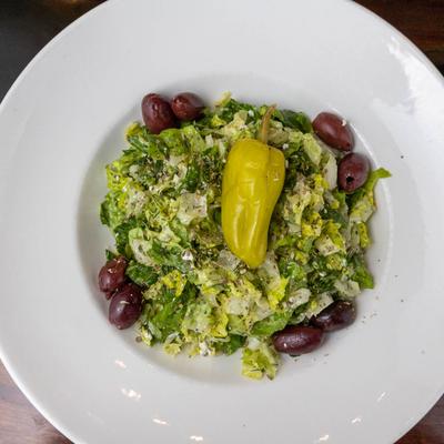 Chopped salad, served, top view, closeup.