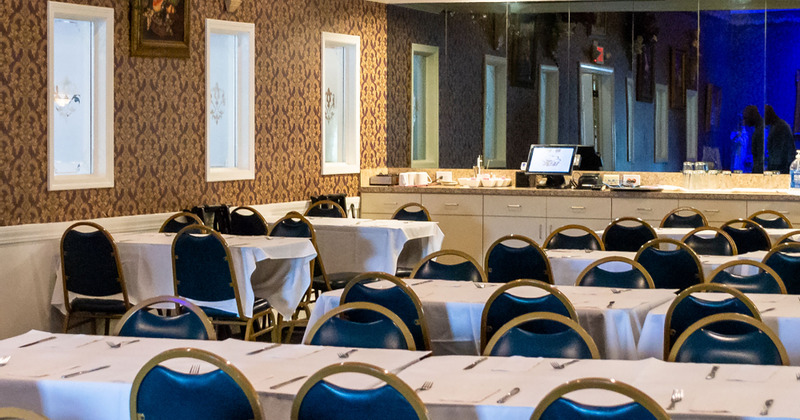 Interior, dining area set with white tablecloth