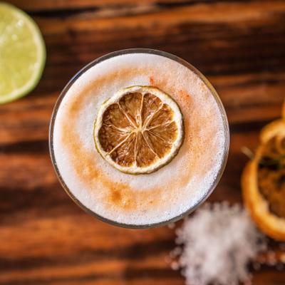 Pisco Sour with dry lime wheel garnish.