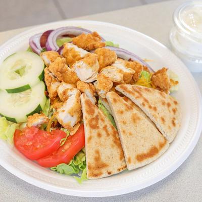 Chicken BLT salad served with pita bread
