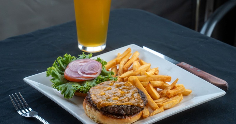 Cheeseburger with fries and a glass of beer