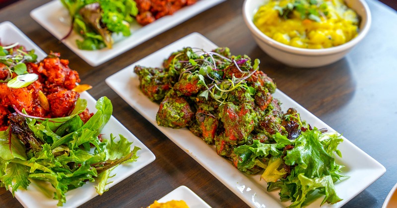 Green chili fried chicken accompanied with other dishes
